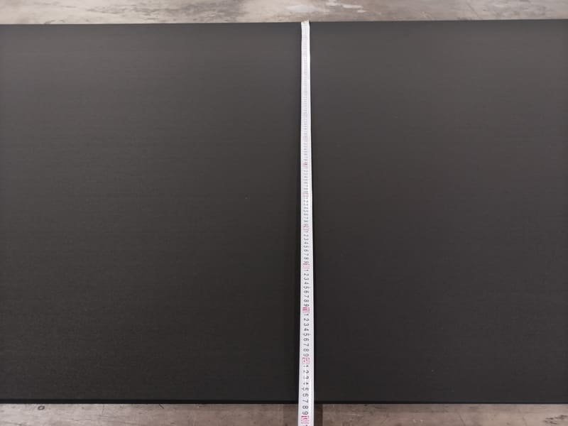 A contractor using a laser measure to accurately calculate room dimensions